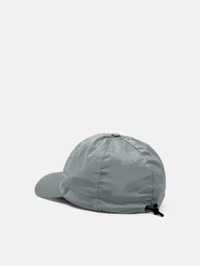 Baseballkeps med dragsko och Compass-brodyr Baseballkeps med dragsko och Compass-brodyr