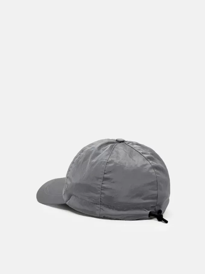 Baseballkeps med dragsko och Compass-brodyr Baseballkeps med dragsko och Compass-brodyr