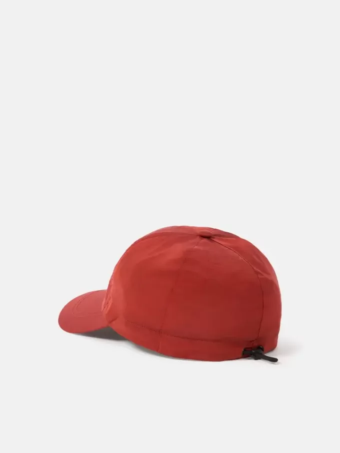 Baseballkeps med dragsko och Compass-brodyr Baseballkeps med dragsko och Compass-brodyr