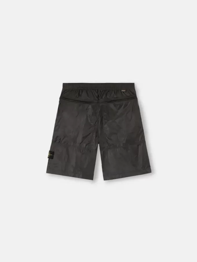 Lösa bermuda-shorts med vid ben och elastisk midja