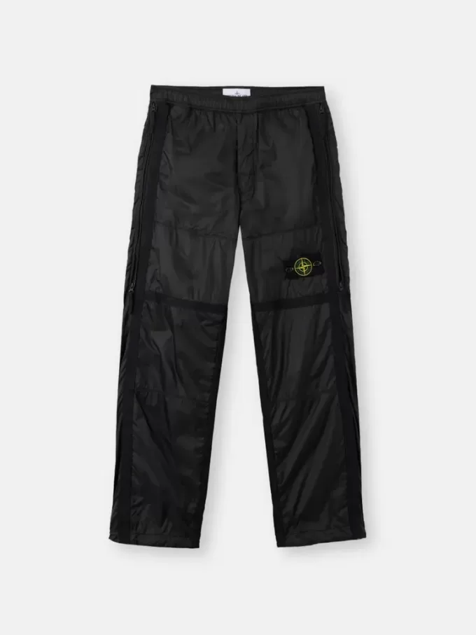 Löst sittande joggingbyxor med fickor med dragkedja och justerbara benslut