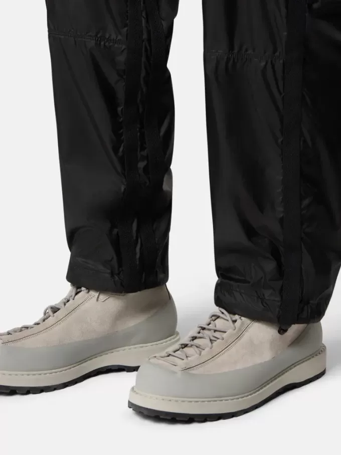 Löst sittande joggingbyxor med fickor med dragkedja och justerbara benslut
