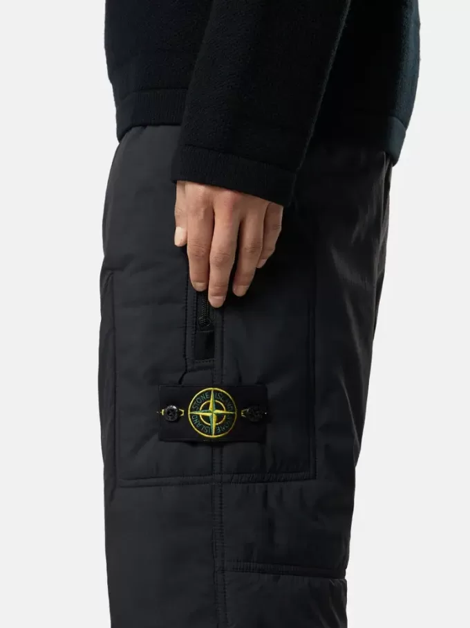 Löst sittande sweatpants med fickor med dragkedja och vaddering Löst sittande sweatpants med fickor med dragkedja och vaddering
