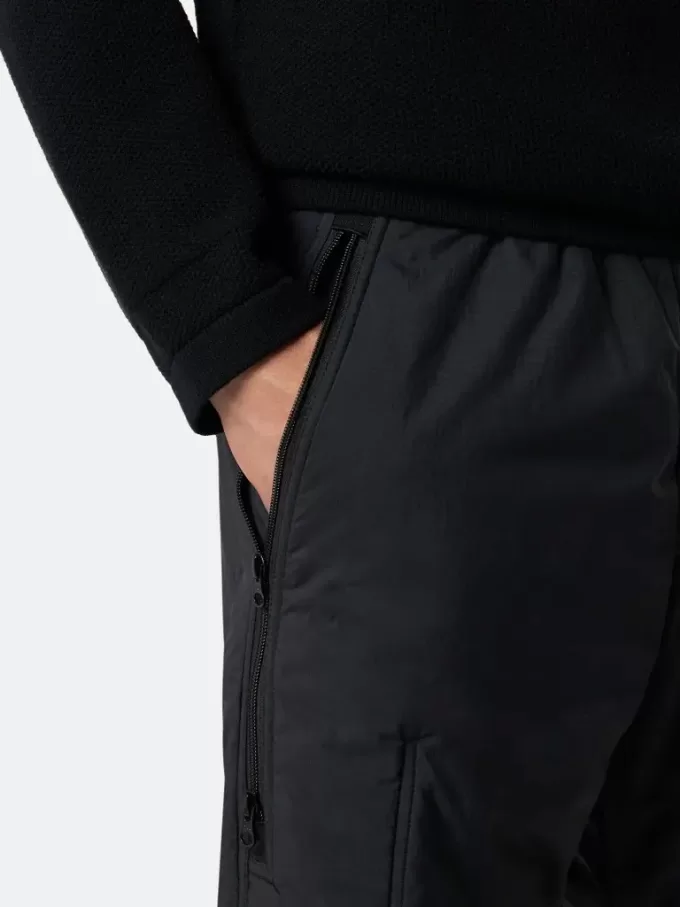 Löst sittande sweatpants med fickor med dragkedja och vaddering Löst sittande sweatpants med fickor med dragkedja och vaddering