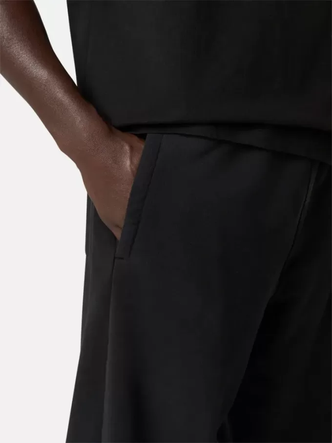 Löst sittande sweatpants med fickor och elastiska muddar