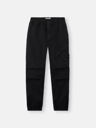Löst sittande sweatpants med tryckknappar och fickor med dragkedja