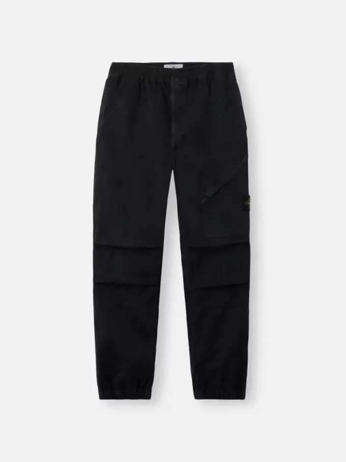 Löst sittande sweatpants med tryckknappar och fickor med dragkedja