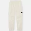 Löst sittande sweatpants med tryckknappar och fickor med dragkedja