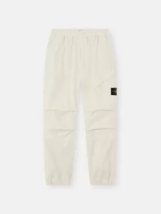 Löst sittande sweatpants med tryckknappar och fickor med dragkedja