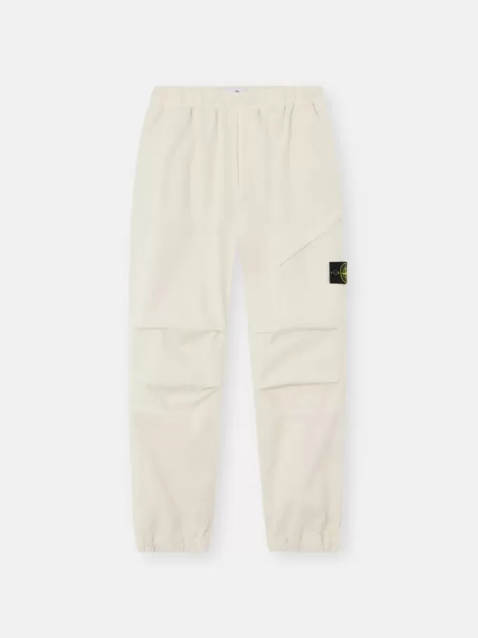 Löst sittande sweatpants med tryckknappar och fickor med dragkedja