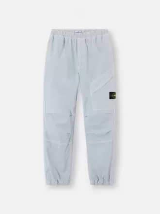 Löst sittande sweatpants med tryckknappar och fickor med dragkedja