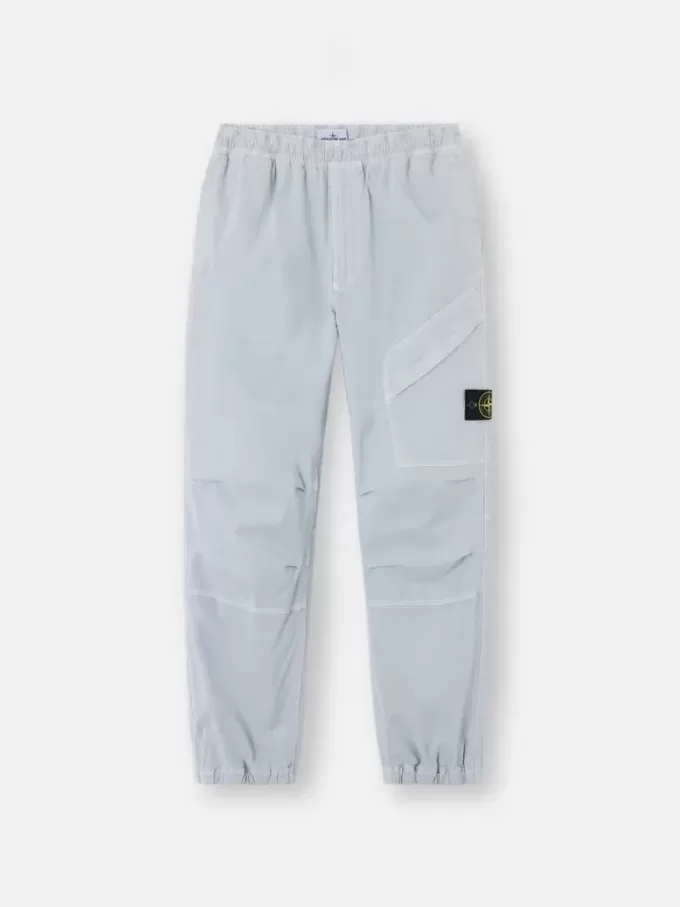 Löst sittande sweatpants med tryckknappar och fickor med dragkedja