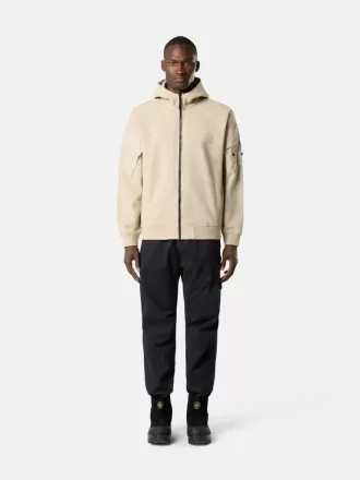 Löst sittande sweatpants med tryckknappar och fickor med dragkedja