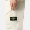 Löst sittande sweatpants med tryckknappar och fickor med dragkedja