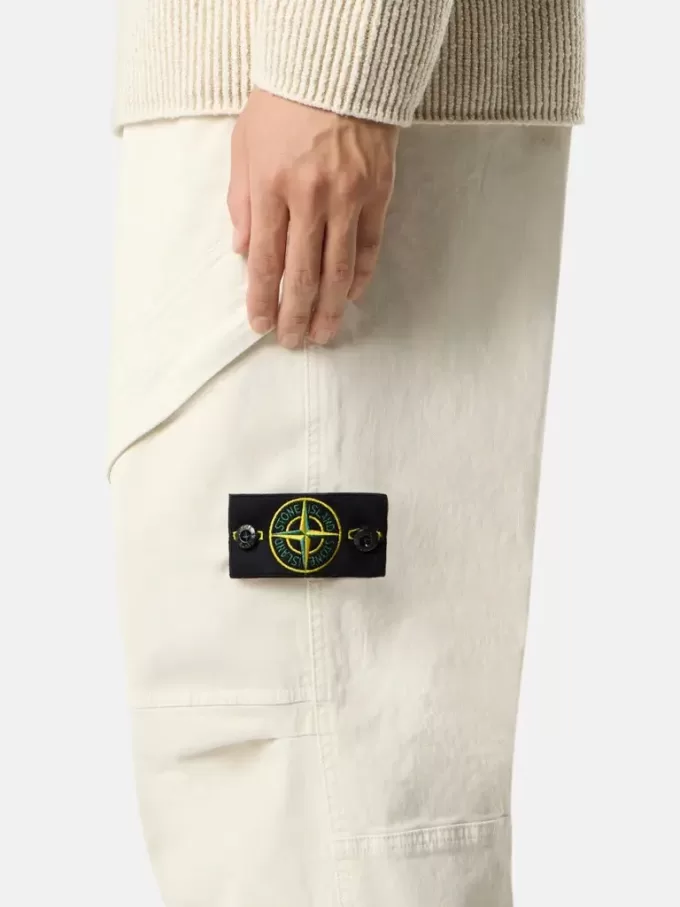 Löst sittande sweatpants med tryckknappar och fickor med dragkedja