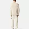 Löst sittande sweatpants med tryckknappar och fickor med dragkedja