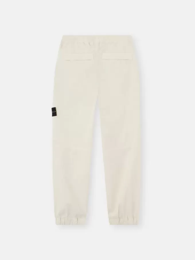 Löst sittande sweatpants med tryckknappar och fickor med dragkedja