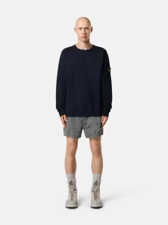 Smal passformade badshorts med fickor och meshfoder